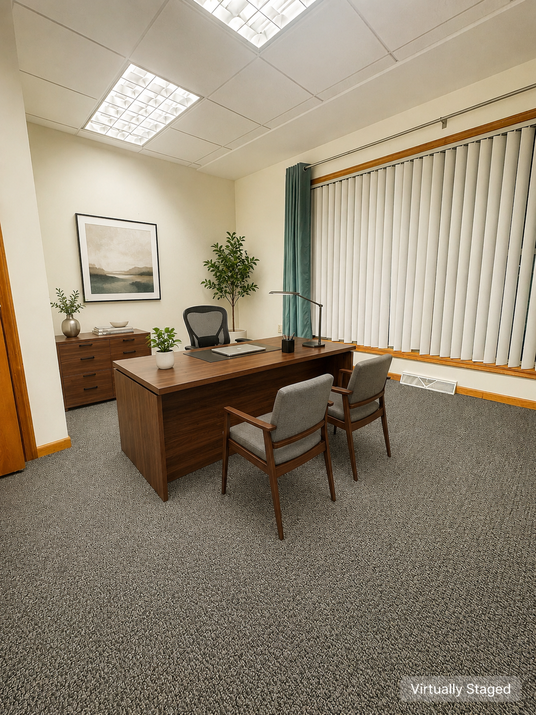 Virtually staged Office Suite F with desk and guest chairs